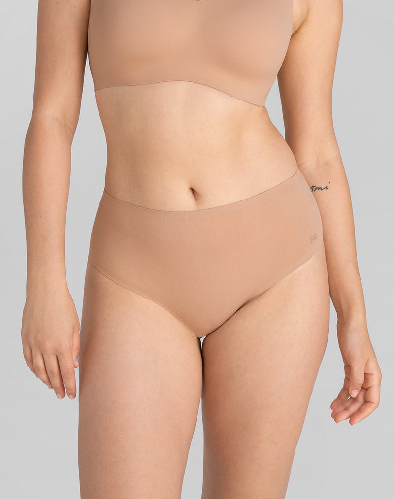 Model Elle wearing SoftForm Cotton High-Rise Brief in size Medium and color Sand, seen from the Front