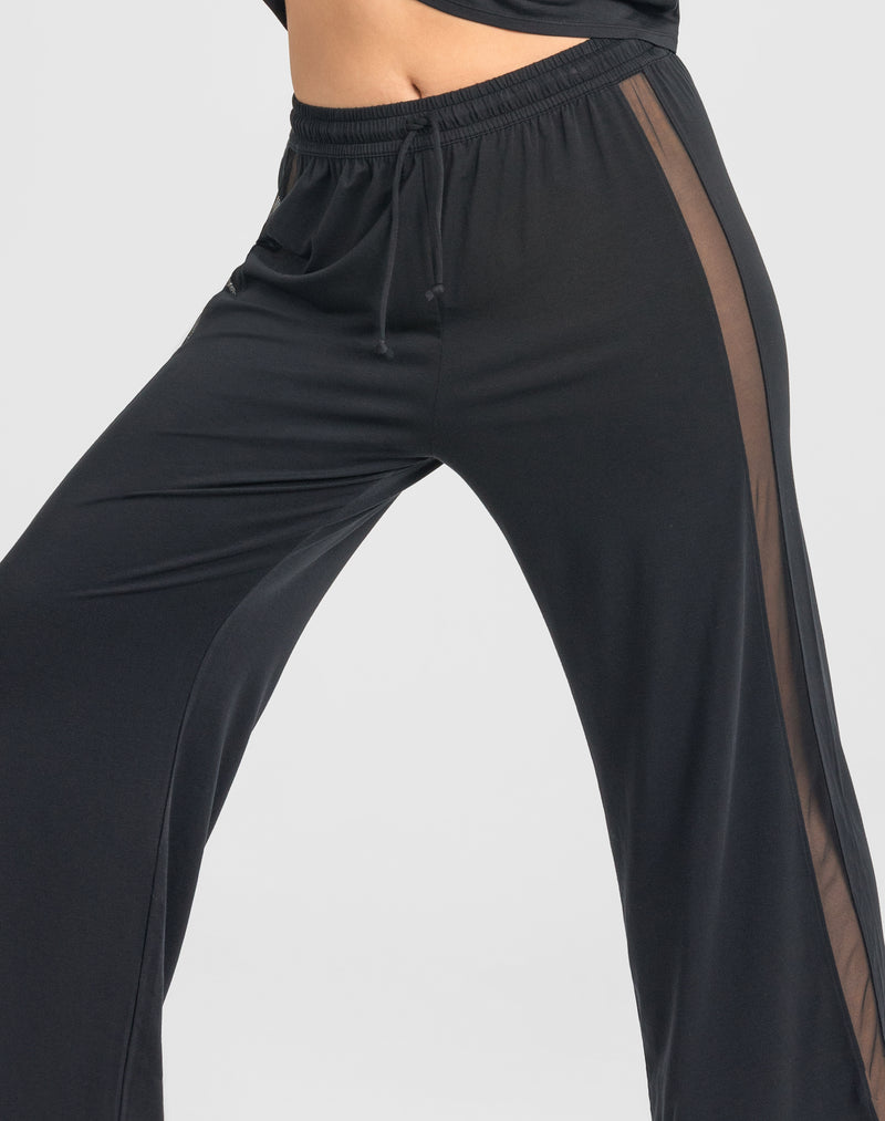 Detail of model wearing BlissWear Pant in color Midnight