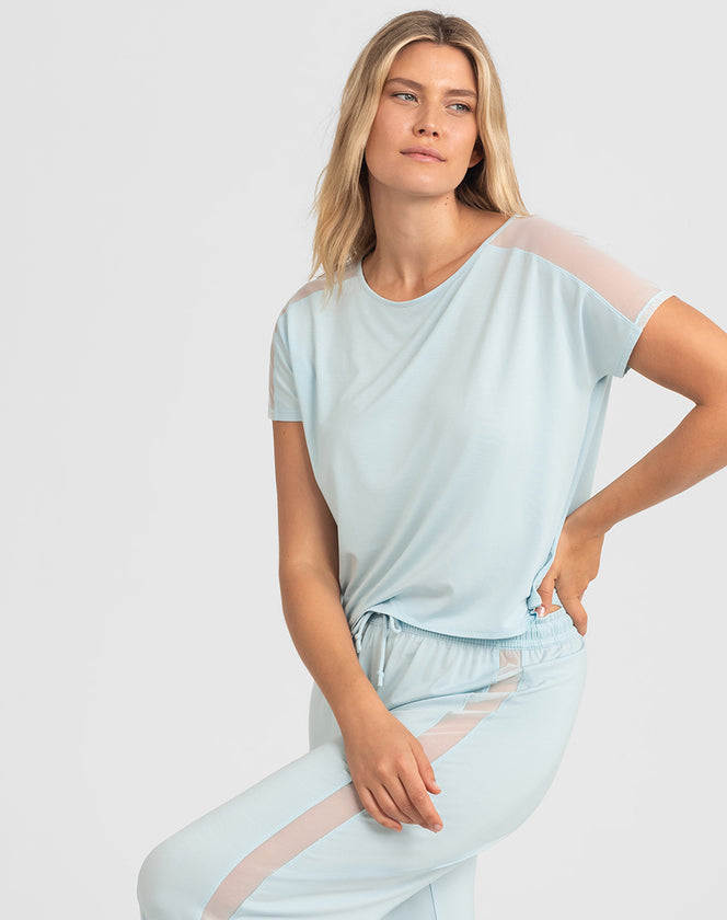 Model Elle wearing blisswear-short-sleeve-top in size Small and color Glacier, seen from the Front