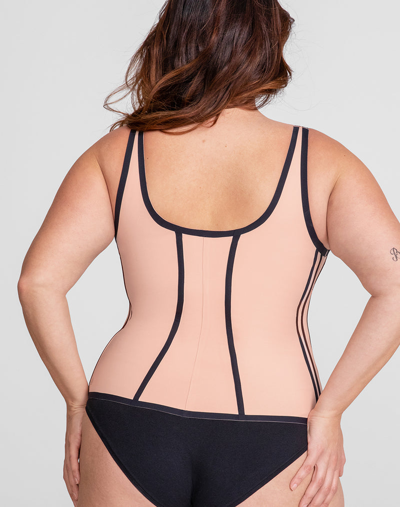 Model Natalie wearing Boldness Tank in size Plus size one and color Rose Tan, seen from the Back