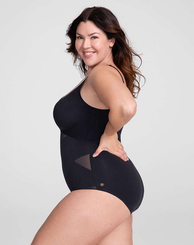 Model Natalie wearing cami-bodysuit in size Plus size one and color Runway, seen from the Side