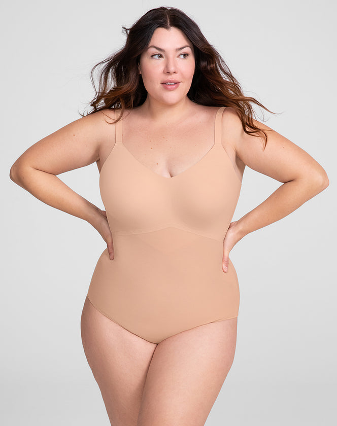 Model Natalie wearing cami-bodysuit in size Plus size one and color Sand, seen from the Front