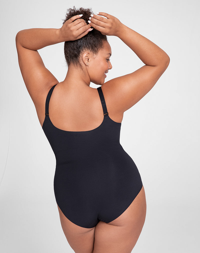 Model Larissa wearing Cami Bodysuit in size Plus size one and color Vamp, seen from the Back