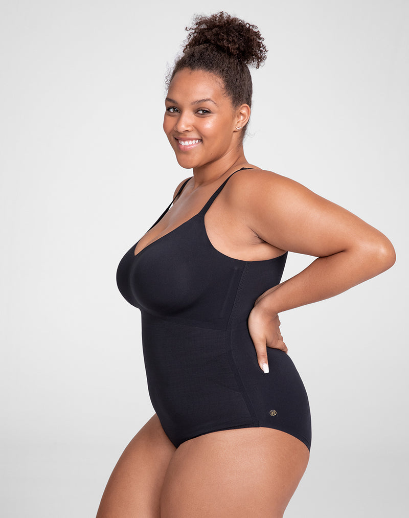 Model Larissa wearing Cami Bodysuit in size Plus size one and color Vamp, seen from the Side