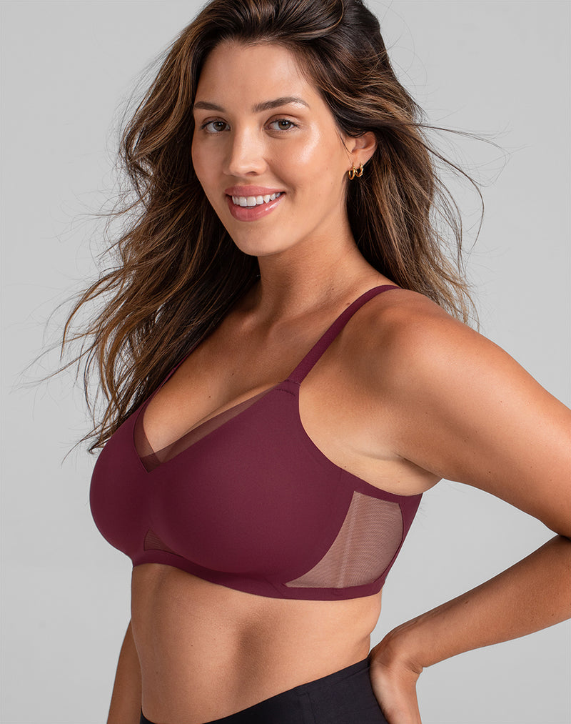 Model Nicki wearing CrossOver Bra in size Medium and color Fig, seen from the Side