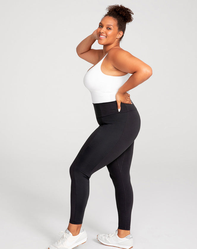 Model Larissa wearing legging-two in size Extra Large and color Jet Black, seen from the Side