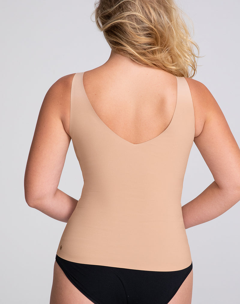 Model McCallah wearing LiftWear Tank in size Large and color Sand, seen from the Back