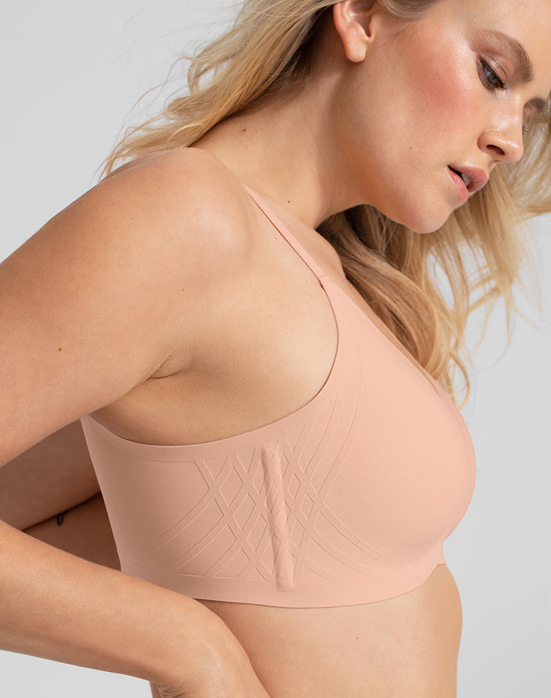 Model Elle wearing Silhouette Bra in size Medium and color Rose Tan, seen from the Side