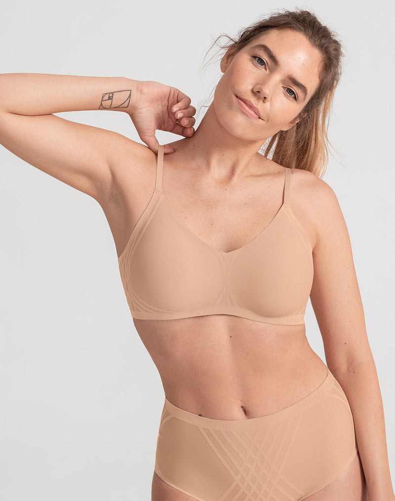Model Katie wearing Silhouette Bra in size Medium and color Sand, seen from the Front