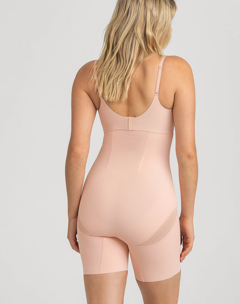 Model Elle wearing SuperPower Short in size Medium and color Rose Tan, seen from the Back