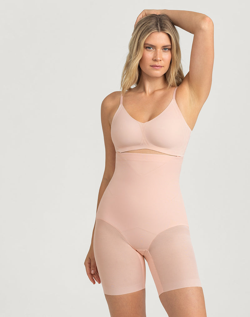 Model Elle wearing SuperPower Short in size Medium and color Rose Tan, seen from the Front