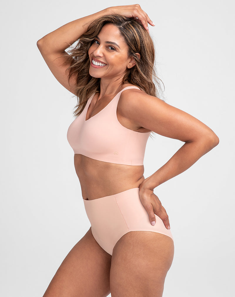 Model Tonya wearing ShineTech Brief in size Medium and color Rose Tan, seen from the Side