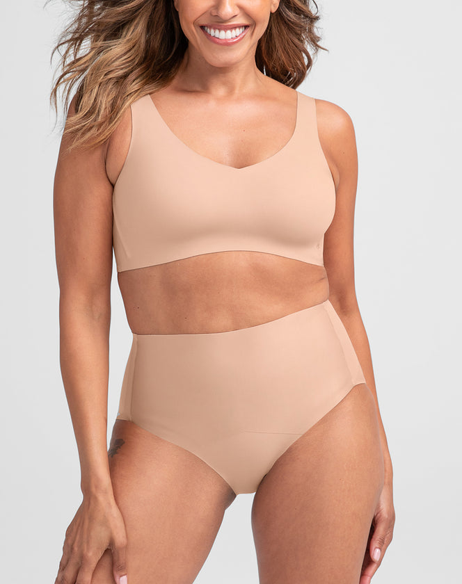 Model Tonya wearing shinetech-brief in size Medium and color Sand, seen from the Front