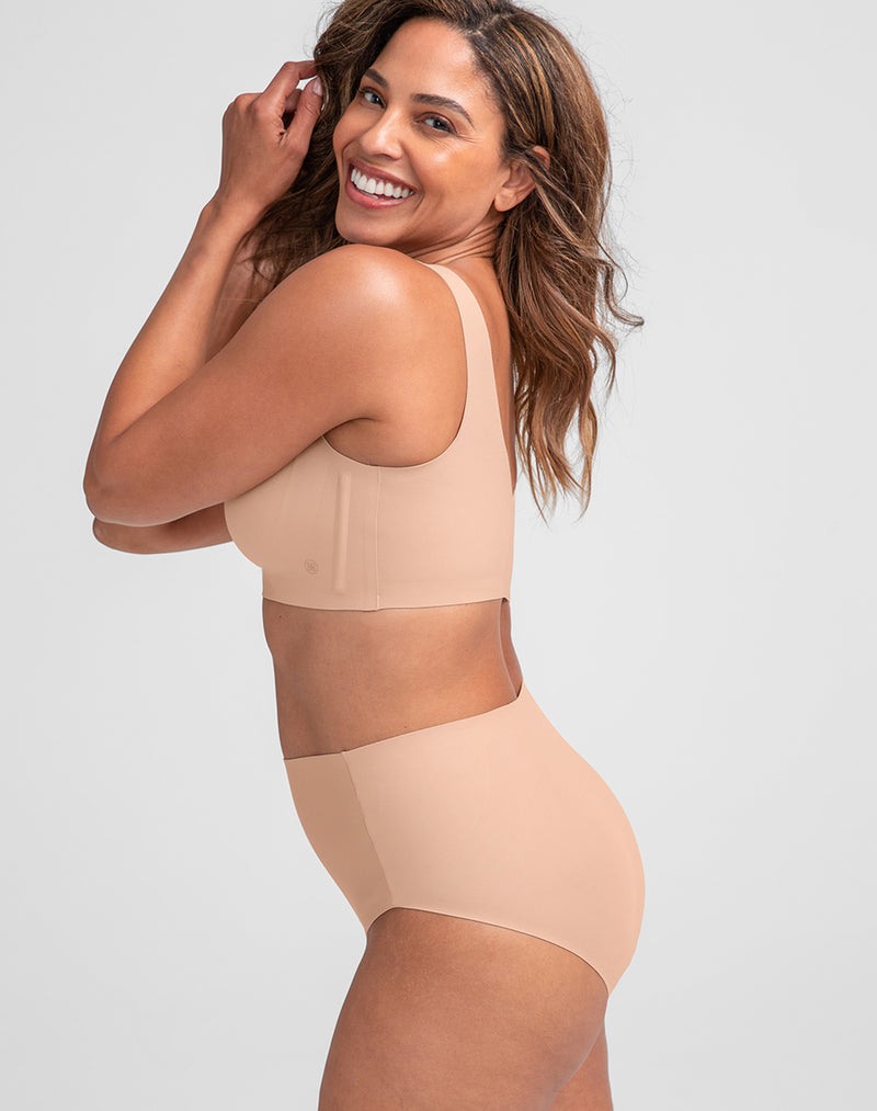 Model Tonya wearing ShineTech Brief in size Medium and color Sand, seen from the Side