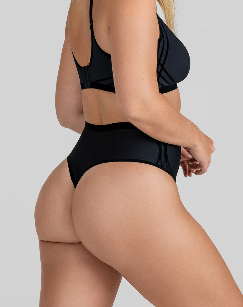 Model McCallah wearing Silhouette Thong in size Large and color Vamp, seen from the Back