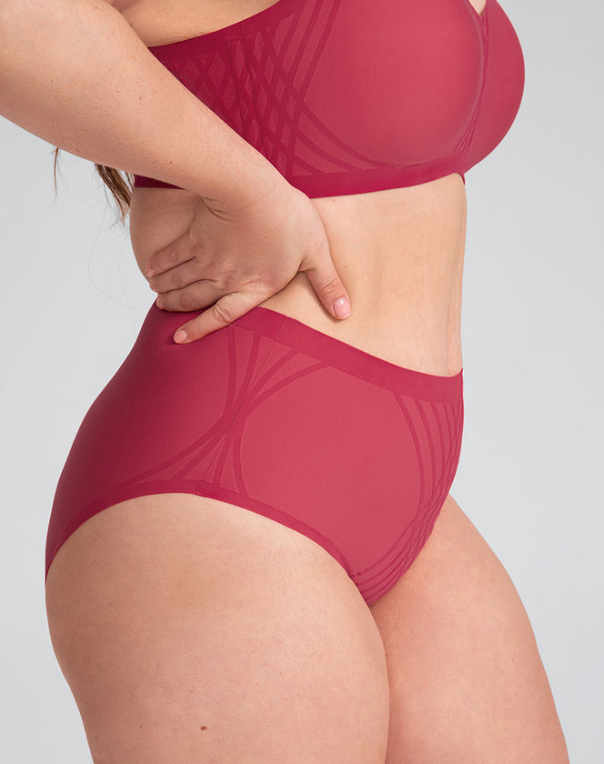 Model Brianna wearing silhouette-brief in size Plus size one and color Peony, seen from the Side