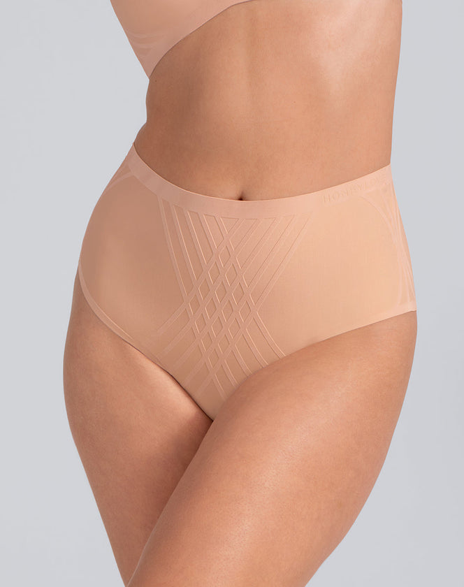 Model Elle wearing silhouette-brief in size Medium and color Rose Tan, seen from the Front