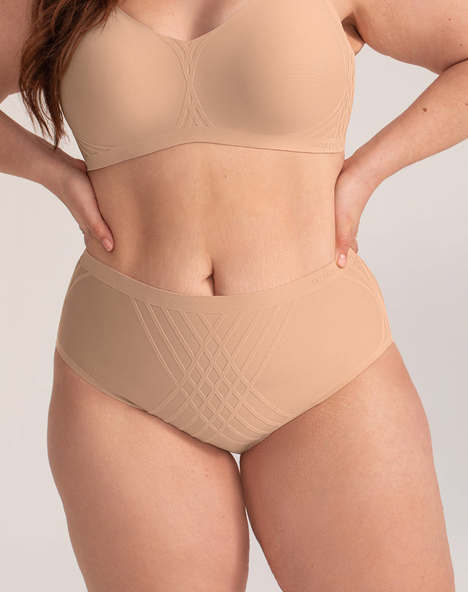 Model Brianna wearing silhouette-brief in size Plus size one and color Sand, seen from the Front