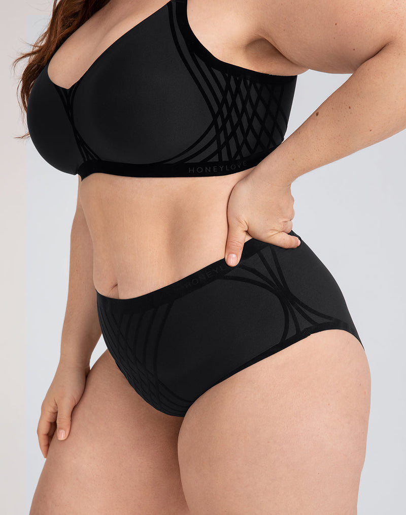 Model Brianna wearing Silhouette Brief in size Plus size one and color Vamp, seen from the Side