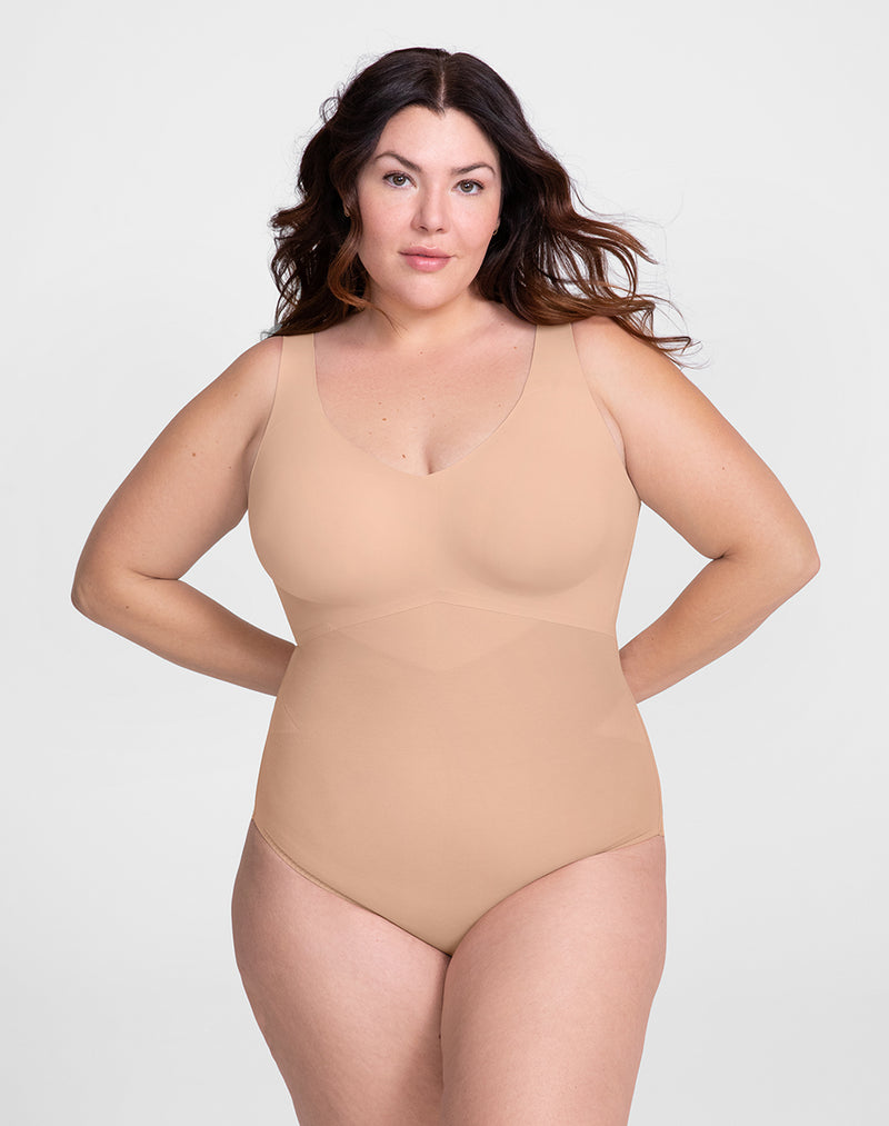 Model Natalie wearing Tank Bodysuit in size Plus size one and color Sand, seen from the Front