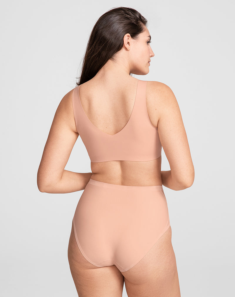 Model Hannah wearing V-Neck Bra in size Medium and color Rose Tan, seen from the Back