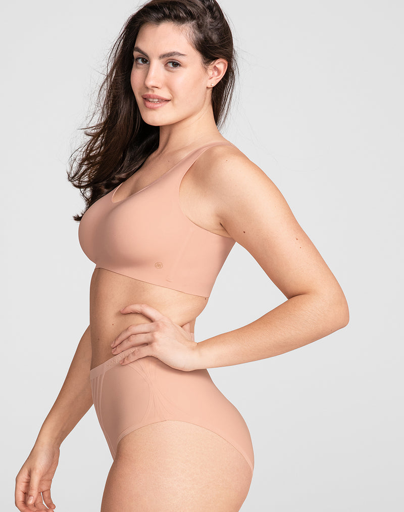 Model Hannah wearing V-Neck Bra in size Medium and color Rose Tan, seen from the Side