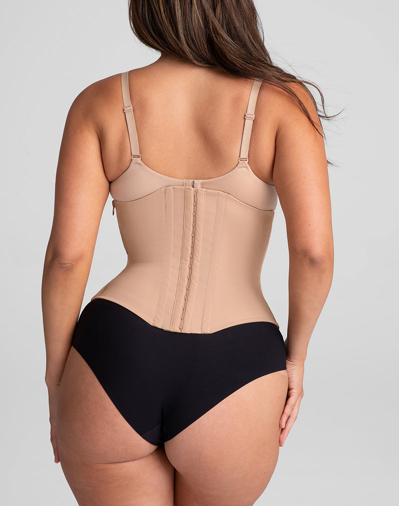 Model Nicki wearing WaistHero Cincher in size Medium and color Sand, seen from the Back