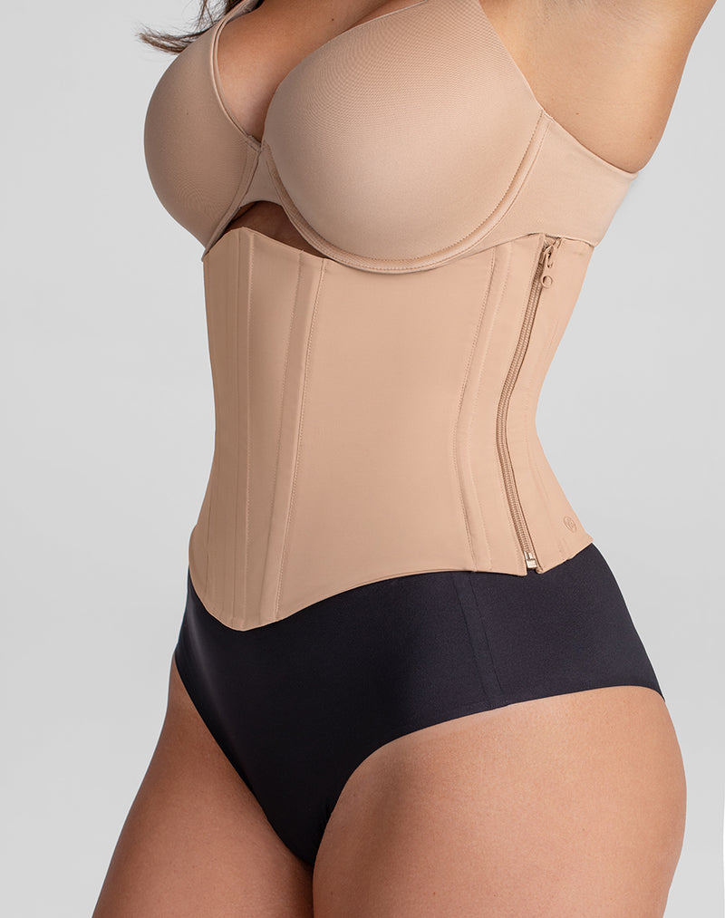 Model Nicki wearing WaistHero Cincher in size Medium and color Sand, seen from the Side
