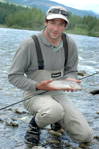 john hollensteiner holds a cutthroat trout on the elk river in Fernie, British Columbia. David Reese photo, Montana Living