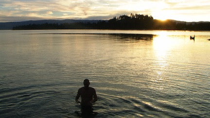 sunset, girl swimming in flathead lake clear water, flathead lake biological station nutrient study, montana living magazine