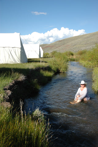 woman in stream, battle creek, cowboy on horse, montana high country cattle drive,montana living, montana high country cattle drive, flynn ranch in townsend montana