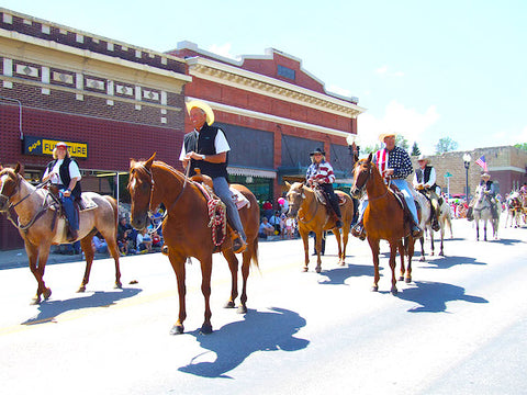 backcountry horsemen parade, visiting downtown lewistown, montana, montana living magazine, snowy mountain range, main street montana town