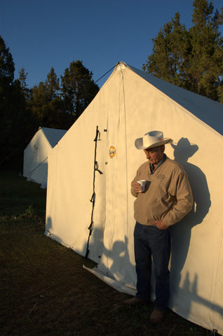 cowboy next to wall tent, cowboy on horse, montana high country cattle drive,montana living, montana high country cattle drive, flynn ranch in townsend montana