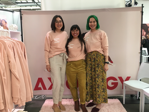 Ericka with members of the Axiology team at a pop-up event