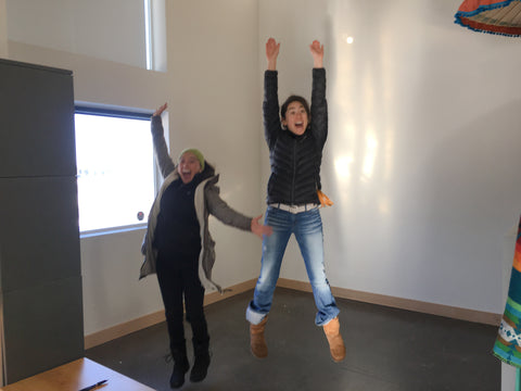 Ericka and Chloe jumping for joy in their first office apartment space