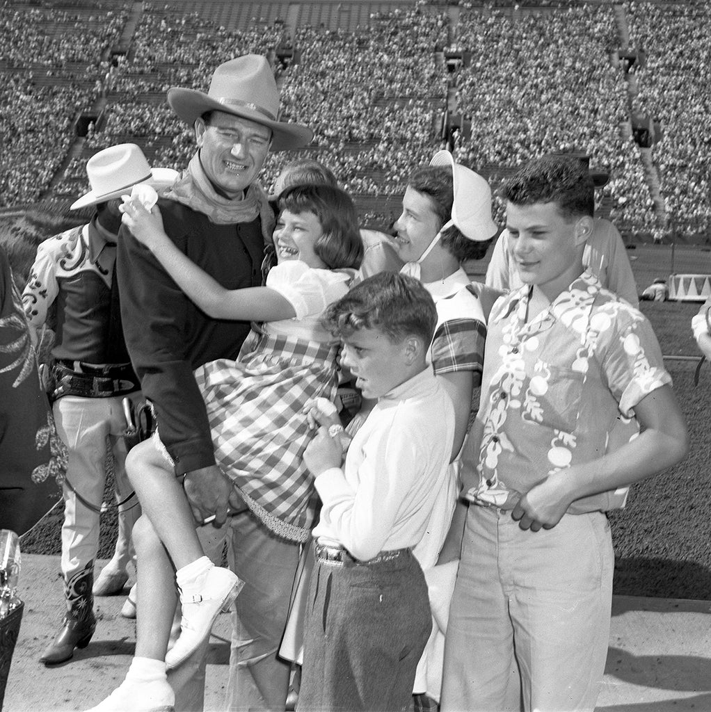 John Wayne and his children at the rodeo