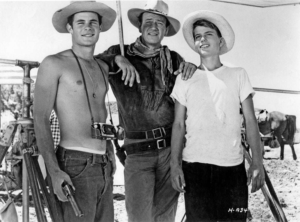 John Wayne with sons on set