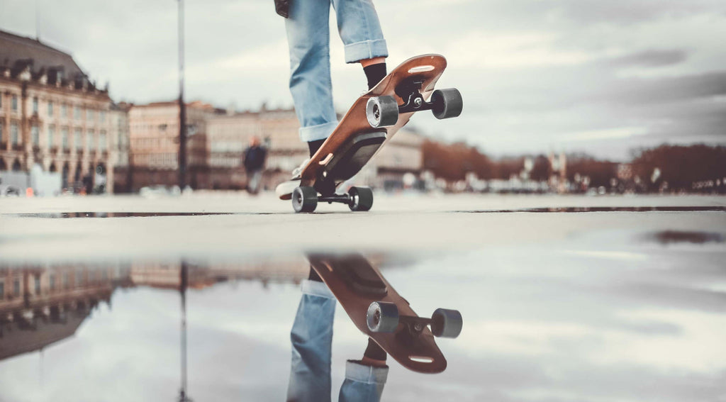 electric skateboard elwing nimbus cruiser reflection city