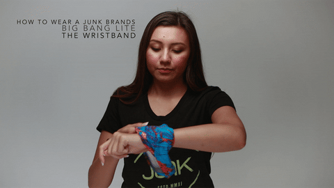woman wraps headband around her wrist