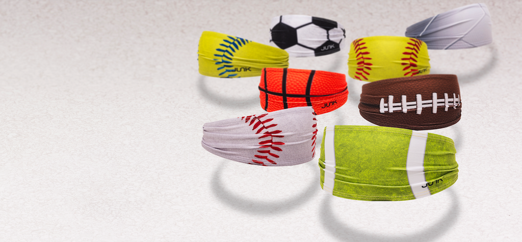 Ball themed headbands on molds floating over a white background