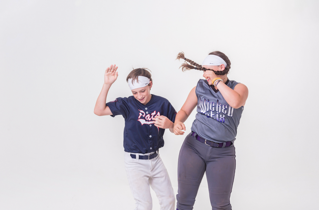 Hip bumping in baseball uniforms and JUNK Headbands