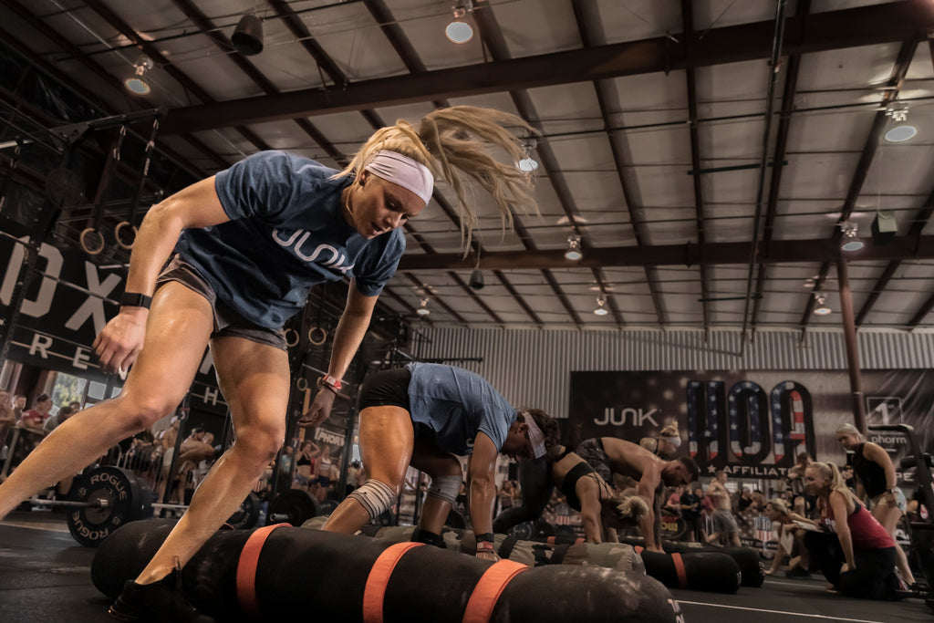 Women's JUNK Team at HOA CrossFit Competition doing Burpees over worms