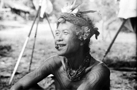 A photo from before 1940 of a tribal tattooed man at Sikakap, Mentawai Islands