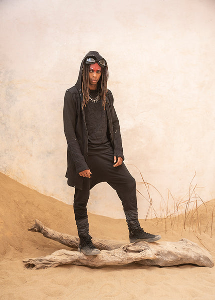 Dune Outfits inspired by galactic rugged elegance. Him: Mask Sleeveless Hoodie, Osaka Long Coat, Eleven Unisex Pants, and the Centipede Monster Necklace by Costume Therapy