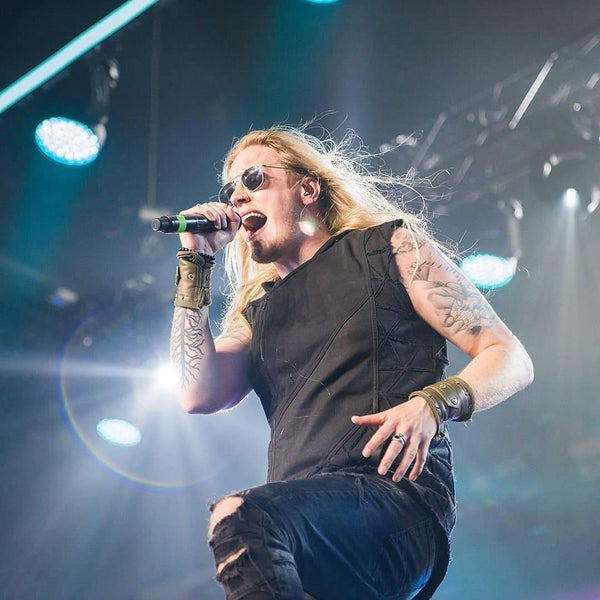 Marc Hudson lead singer of Dragonforce wearing Psylo fashion streetwear on stage