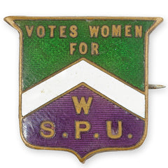 a Votes for Women badge in the colours of the suffragette movement