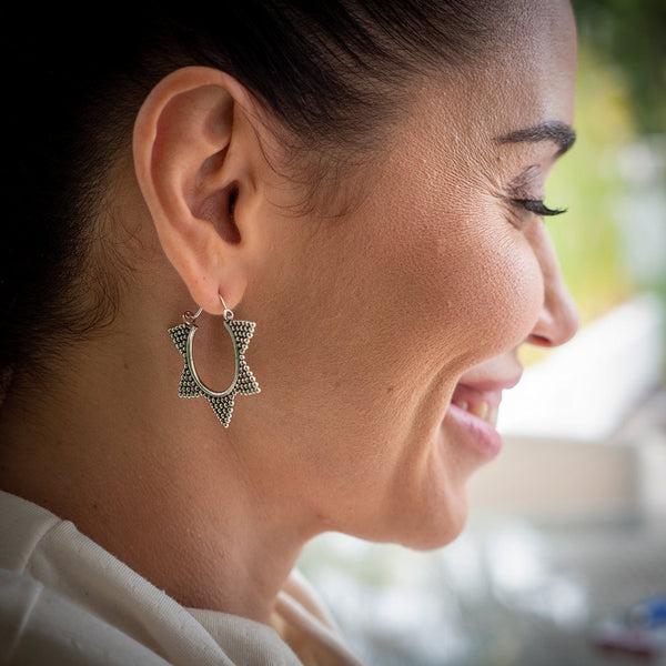 woman wearing Tribali tribal hoop earrings