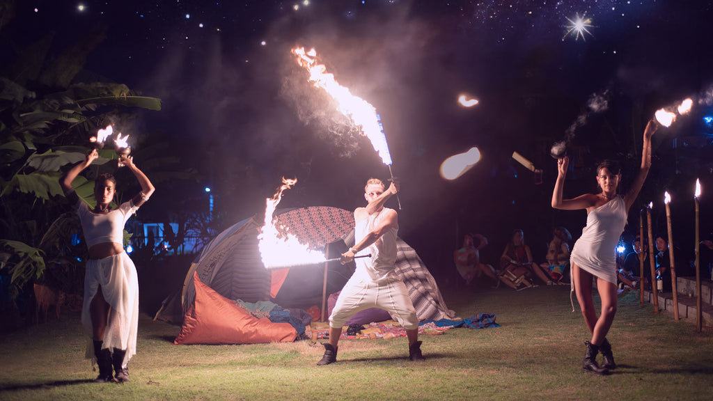 Fire jugglers wearing Psylo Fashion festival outfits