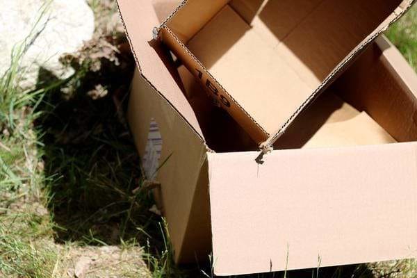 Pile of cardboard boxes on a lawn