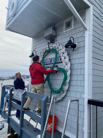 decorating the drawbridge for the Mystic Irish Parade